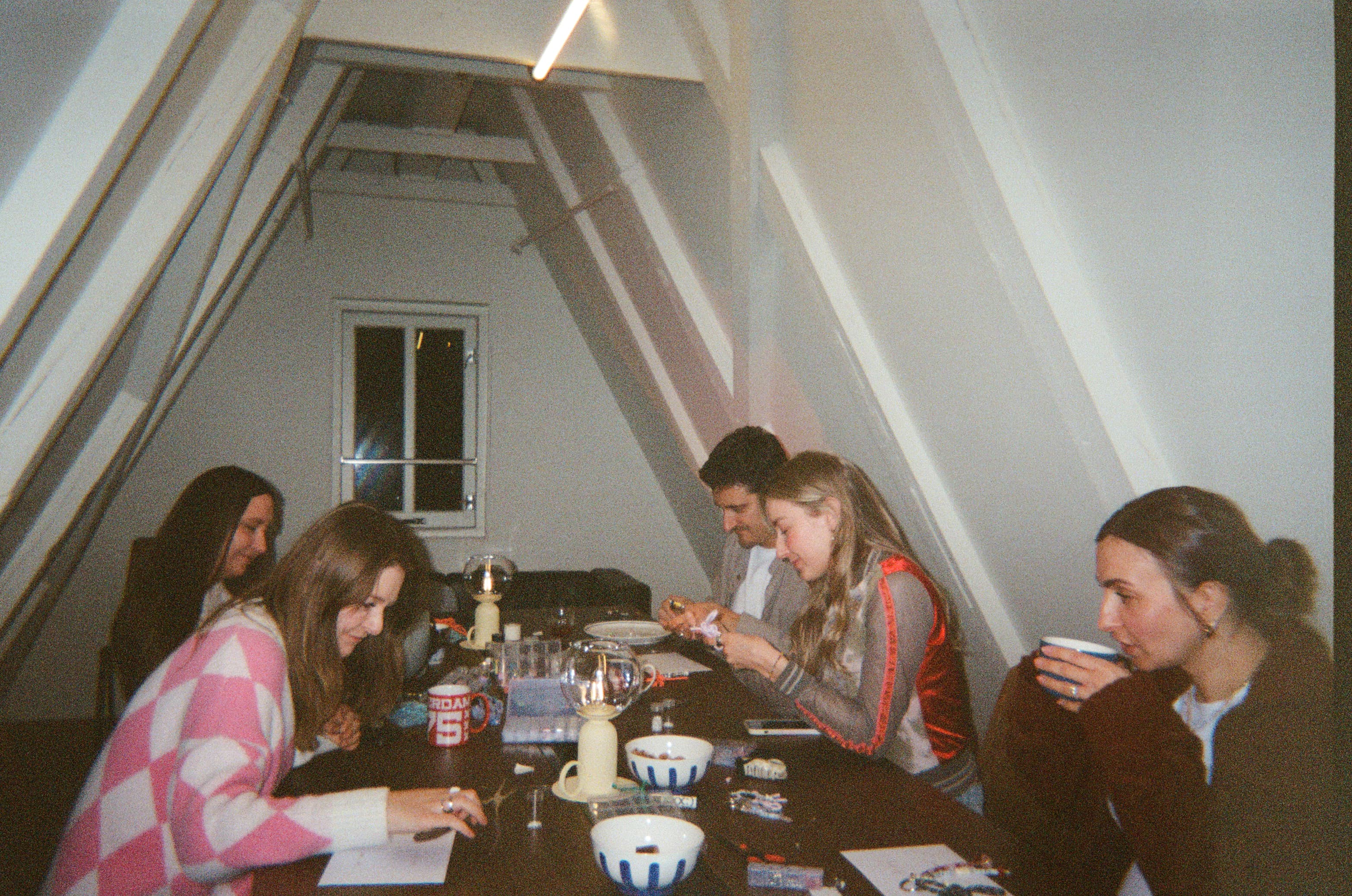 Friends gathered around a table at a supper club